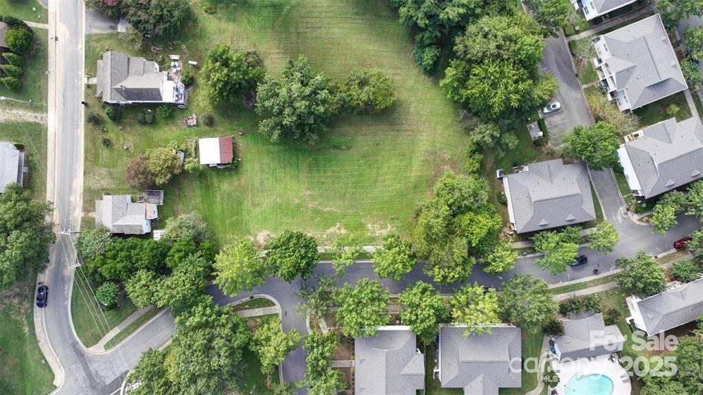 an aerial view of house with yard swimming pool and outdoor seating