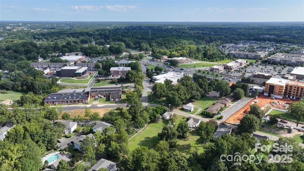 19623 Oak Street Cornelius, NC 28031 - Photo 2 of 6 an aerial view of residential houses with outdoor space and trees