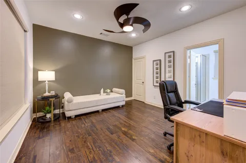 a work room with furniture and wooden floor