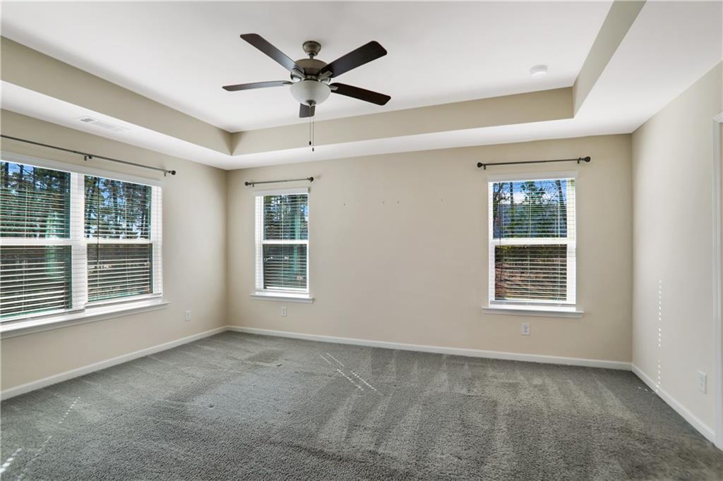 7139 Southface Way Southwest Austell, GA 30168 - Photo 14 of 27 an empty room with a window and a ceiling fan