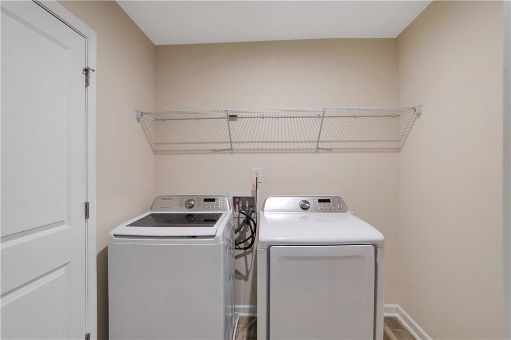 7139 Southface Way Southwest Austell, GA 30168 - Photo 19 of 27 a utility room with dryer and washer