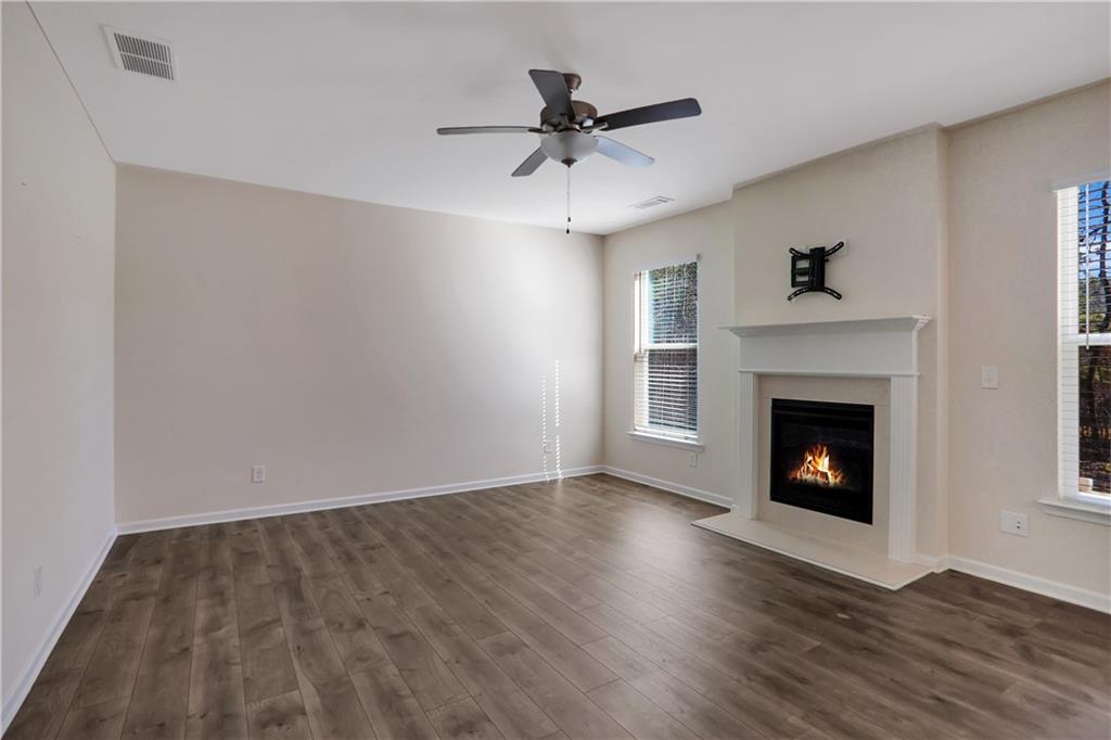 7139 Southface Way Southwest Austell, GA 30168 - Photo 6 of 27 a view of a livingroom with a fireplace and wooden floor