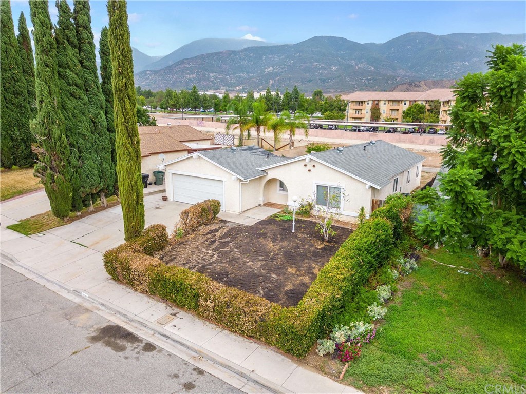 1560 Ranch Road San Bernardino, CA 92407 - Photo 1 of 1 a view of a house with a yard and sitting area