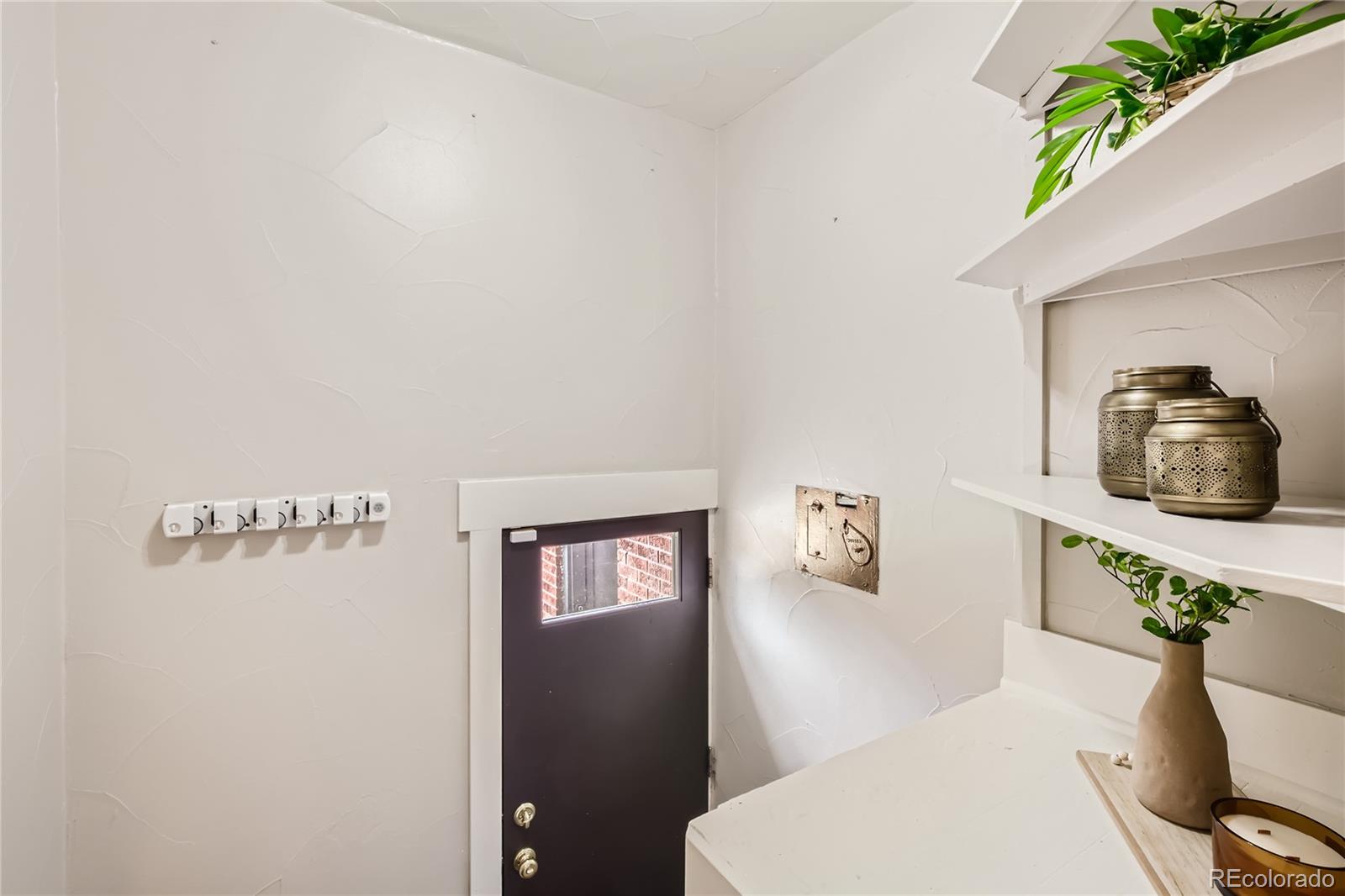 3449 Monroe Street Denver, CO 80205 - Photo 13 of 16 a bathroom with a toilet