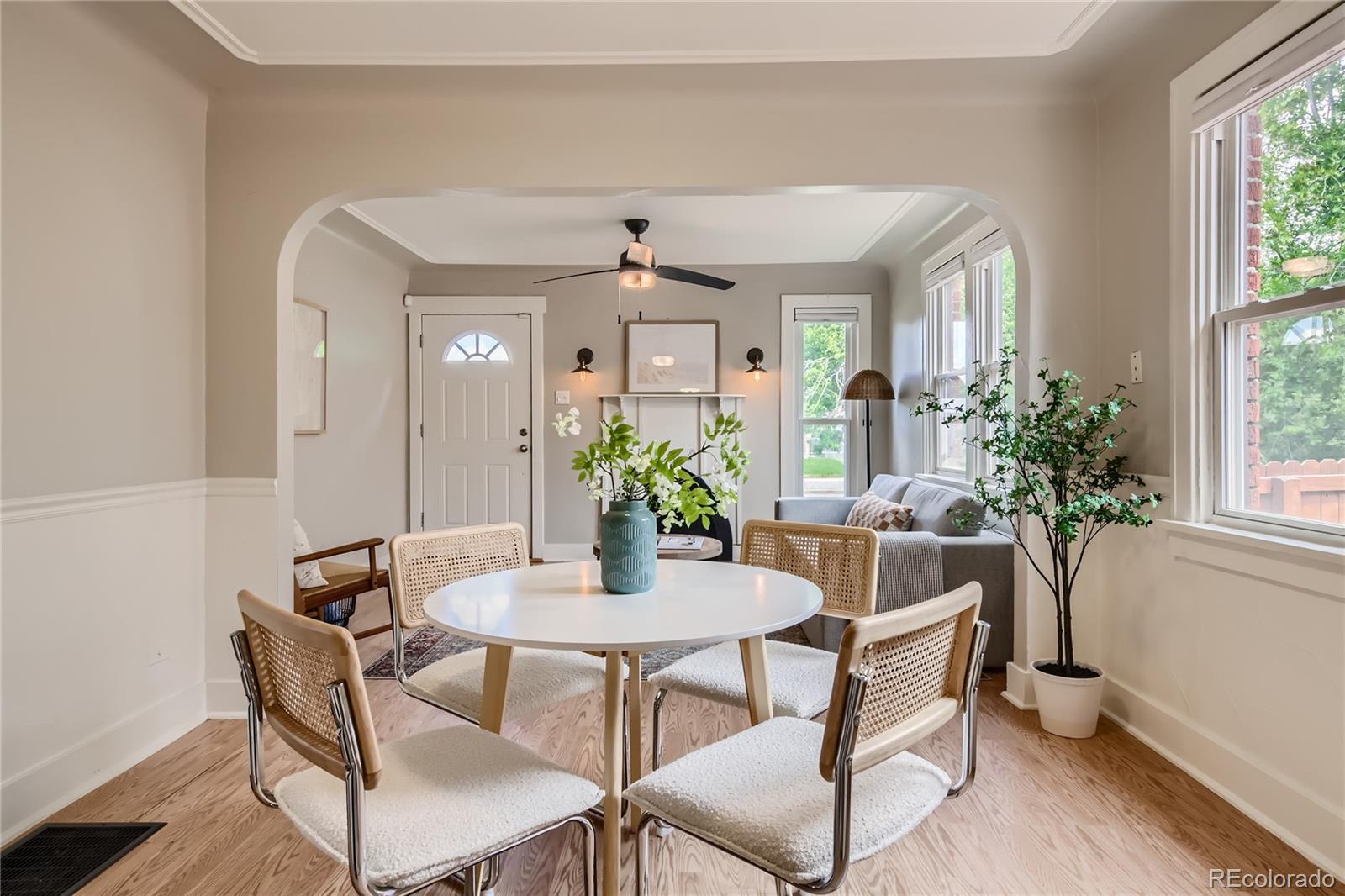3449 Monroe Street Denver, CO 80205 - Photo 3 of 16 a dining room with furniture and window