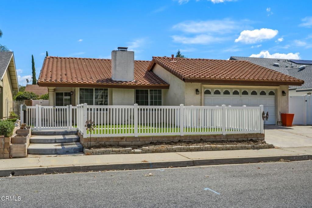 2082 Belgrave Court Simi Valley, CA 93063 - Photo 11 of 56 a view of a house with a small yard and wooden fence