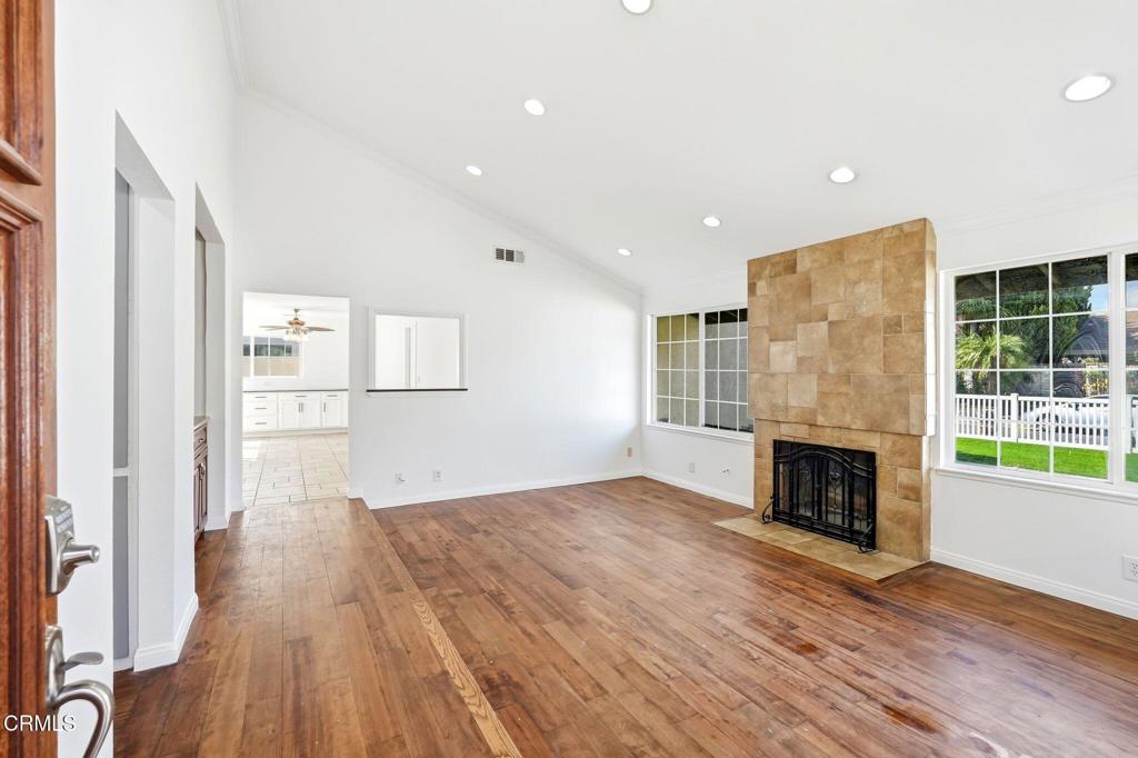 2082 Belgrave Court Simi Valley, CA 93063 - Photo 13 of 56 a view of empty room with wooden floor and fireplace