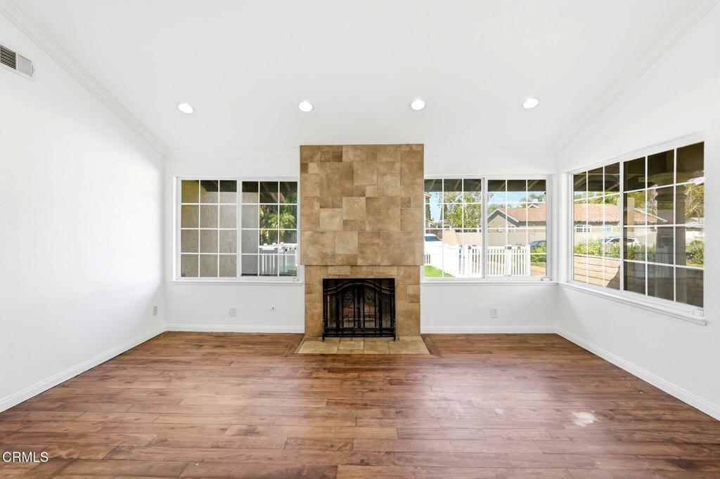 2082 Belgrave Court Simi Valley, CA 93063 - Photo 14 of 56 an empty room with windows and fireplace