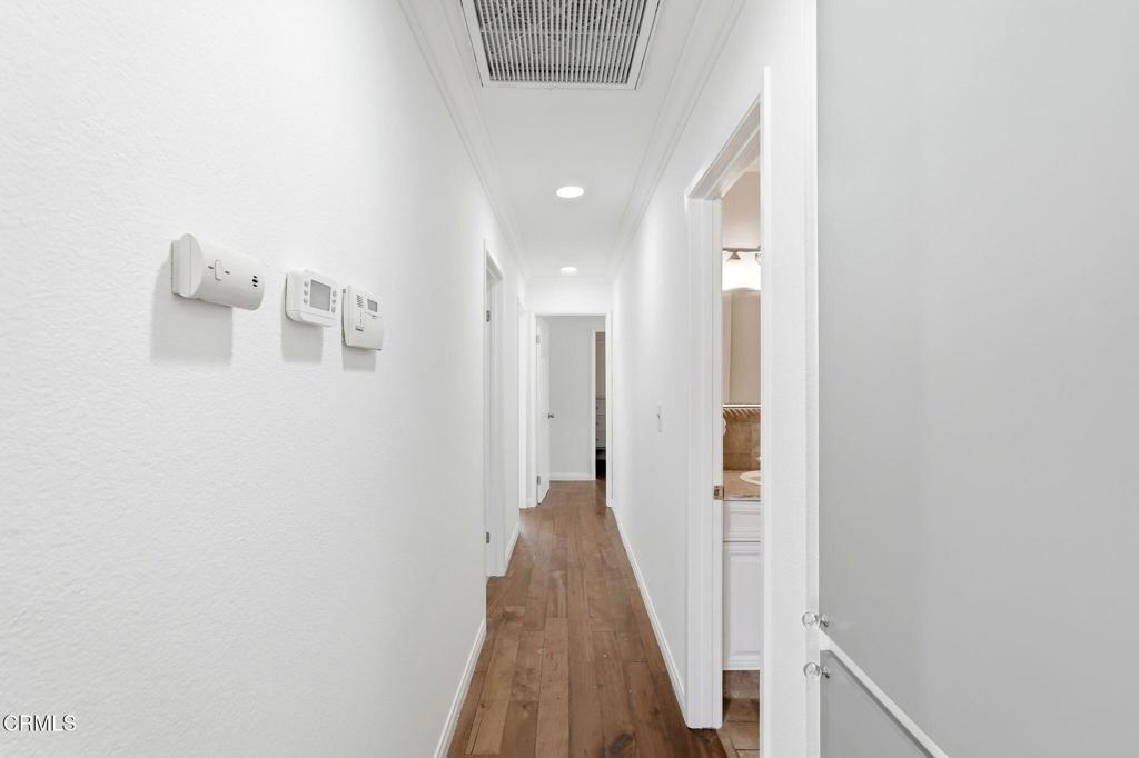 2082 Belgrave Court Simi Valley, CA 93063 - Photo 25 of 56 a view of a hallway with wooden floor and staircase