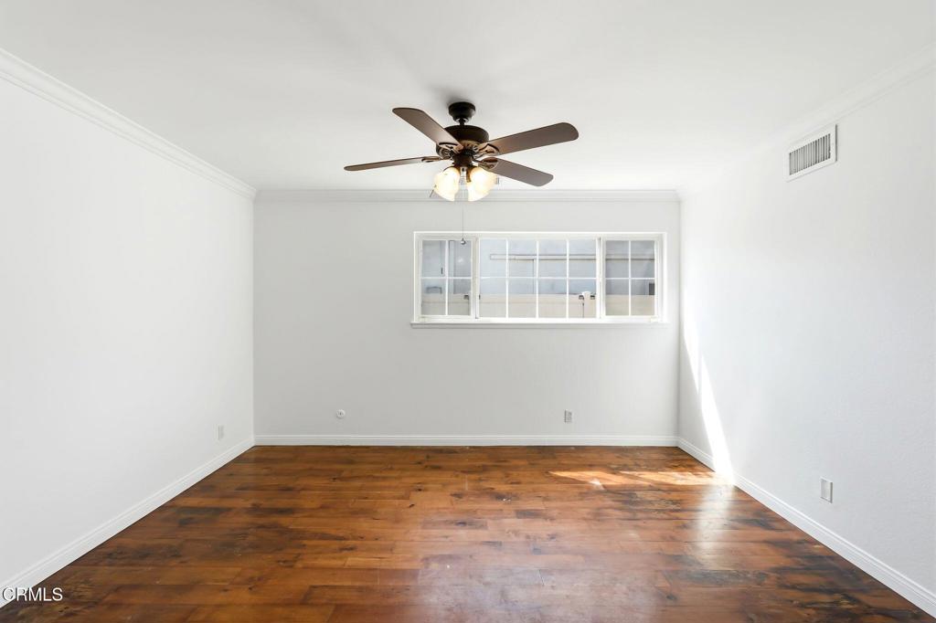 2082 Belgrave Court Simi Valley, CA 93063 - Photo 29 of 56 an empty room with a window and a ceiling fan