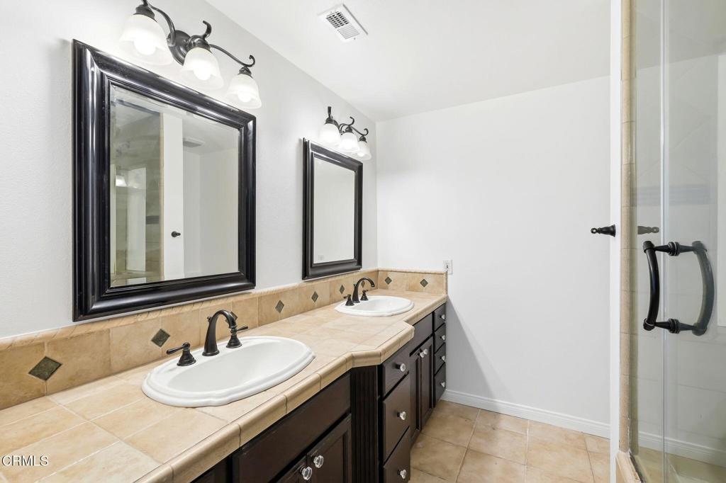 2082 Belgrave Court Simi Valley, CA 93063 - Photo 32 of 56 a bathroom with a sink and a mirror