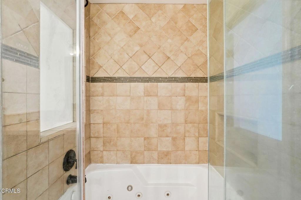 2082 Belgrave Court Simi Valley, CA 93063 - Photo 34 of 56 a bathroom with a bathtub and shower