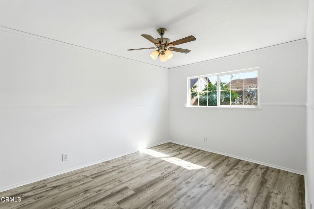 2082 Belgrave Court Simi Valley, CA 93063 - Photo 35 of 56 an empty room with a window and a ceiling fan