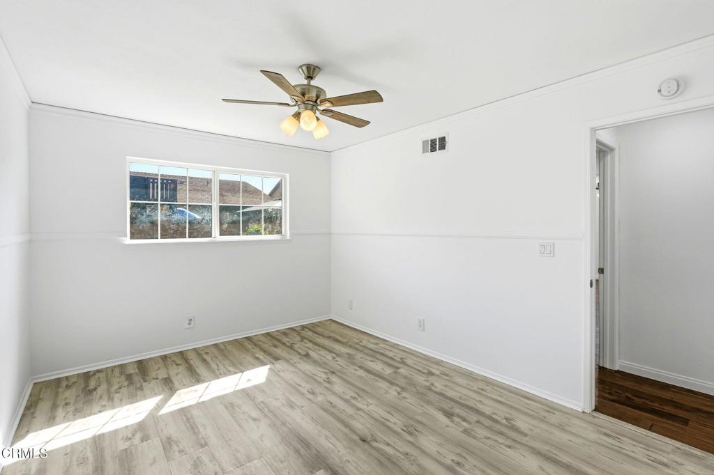 2082 Belgrave Court Simi Valley, CA 93063 - Photo 36 of 56 a view of empty room with wooden floor and fan