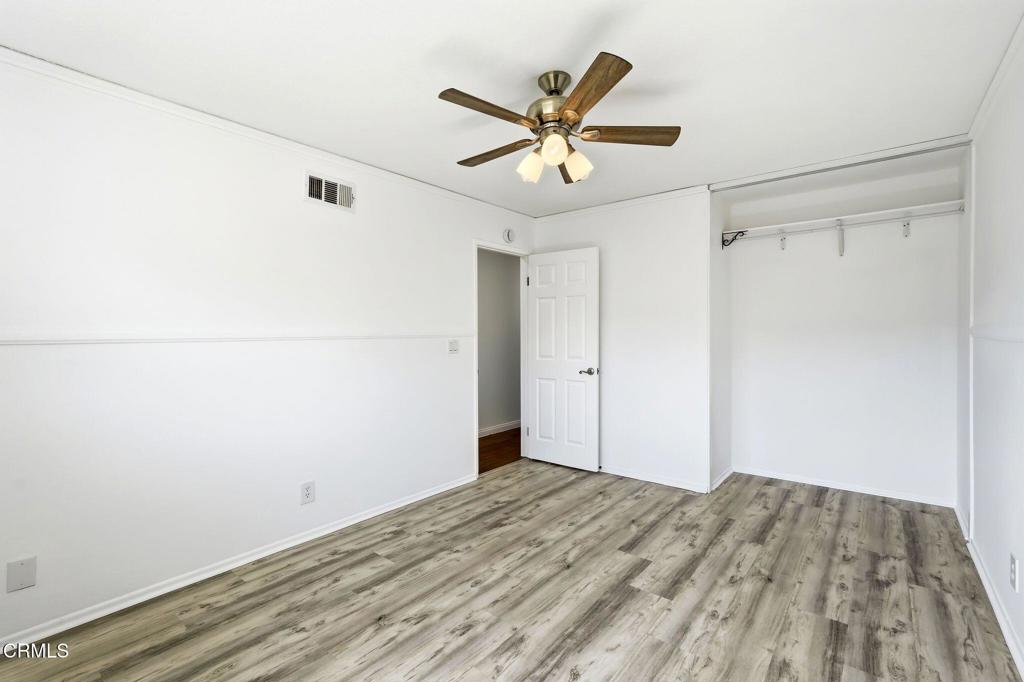 2082 Belgrave Court Simi Valley, CA 93063 - Photo 37 of 56 a view of a big room with wooden floor and a ceiling fan