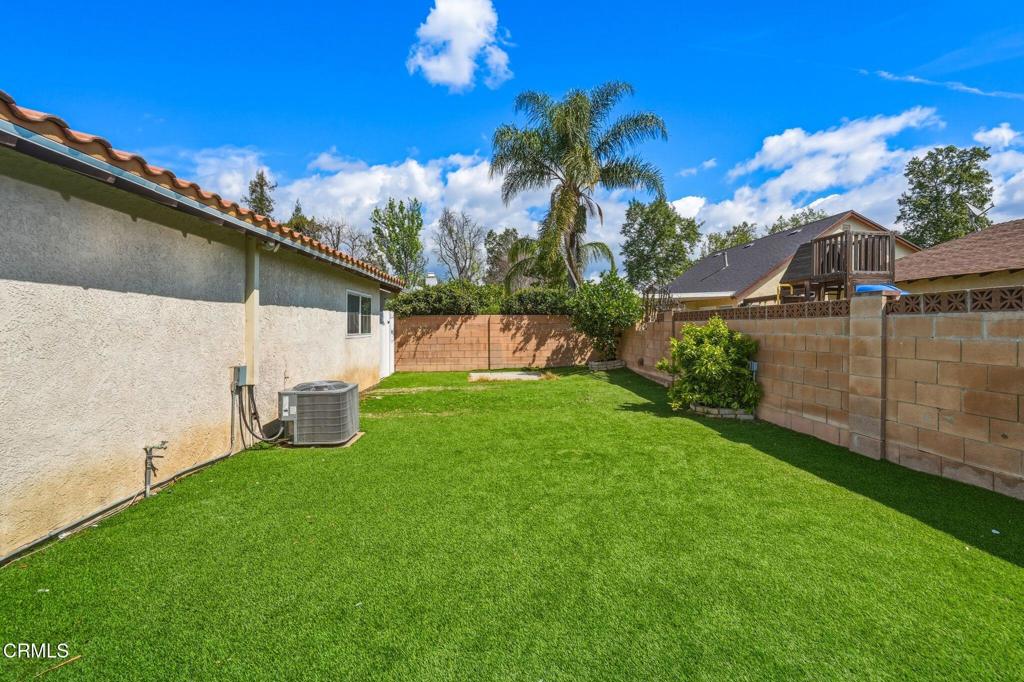 2082 Belgrave Court Simi Valley, CA 93063 - Photo 46 of 56 a view of a back yard with a large tree