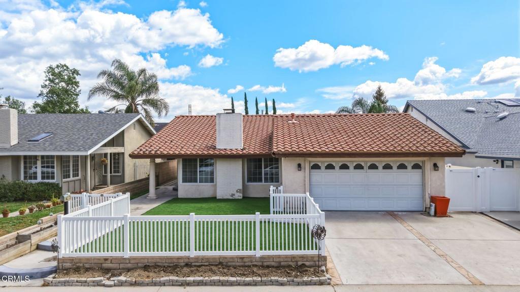 2082 Belgrave Court Simi Valley, CA 93063 - Photo 6 of 56 a front view of a house with a garden