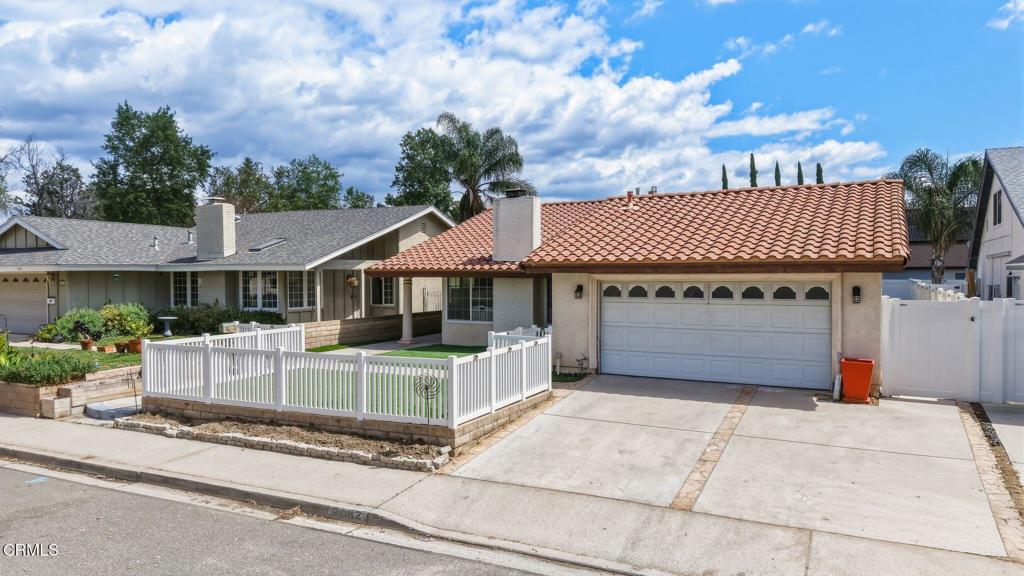 2082 Belgrave Court Simi Valley, CA 93063 - Photo 7 of 56 a front view of a house with a garden