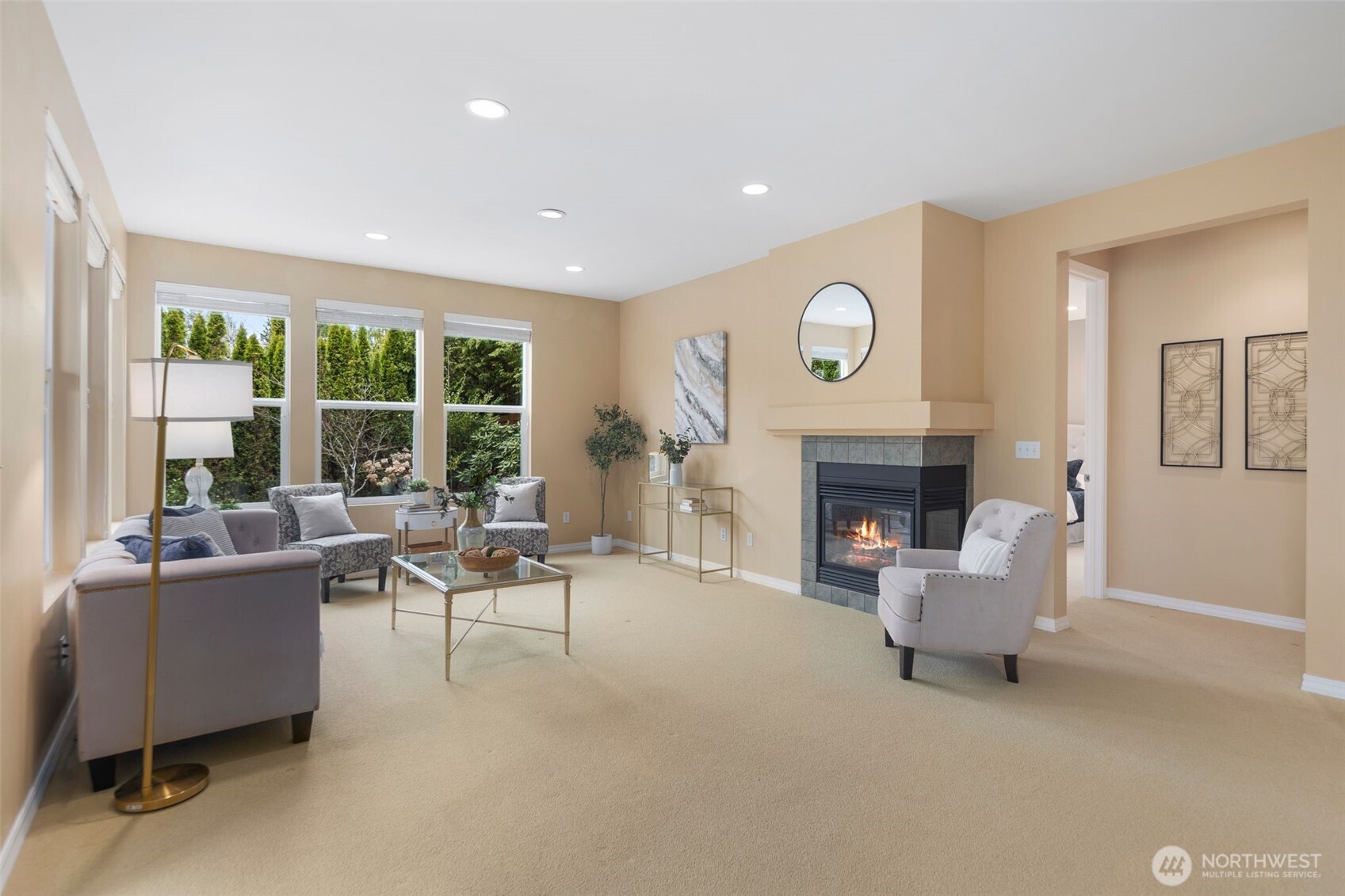 23124 Northeast Devon Way Redmond, WA 98053 - Photo 12 of 34 a living room with furniture a fireplace and a large window