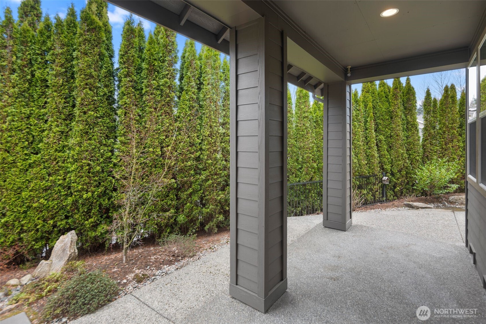 23124 Northeast Devon Way Redmond, WA 98053 - Photo 29 of 34 a view of a garden with plants and a bench