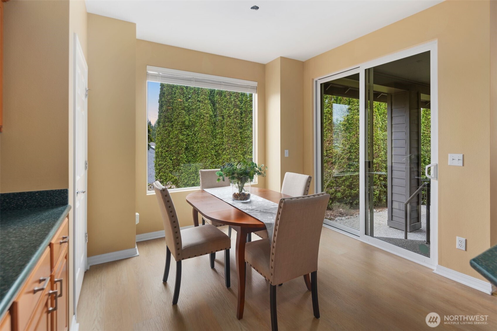 23124 Northeast Devon Way Redmond, WA 98053 - Photo 8 of 34 a view of a dining room with furniture window and outside view