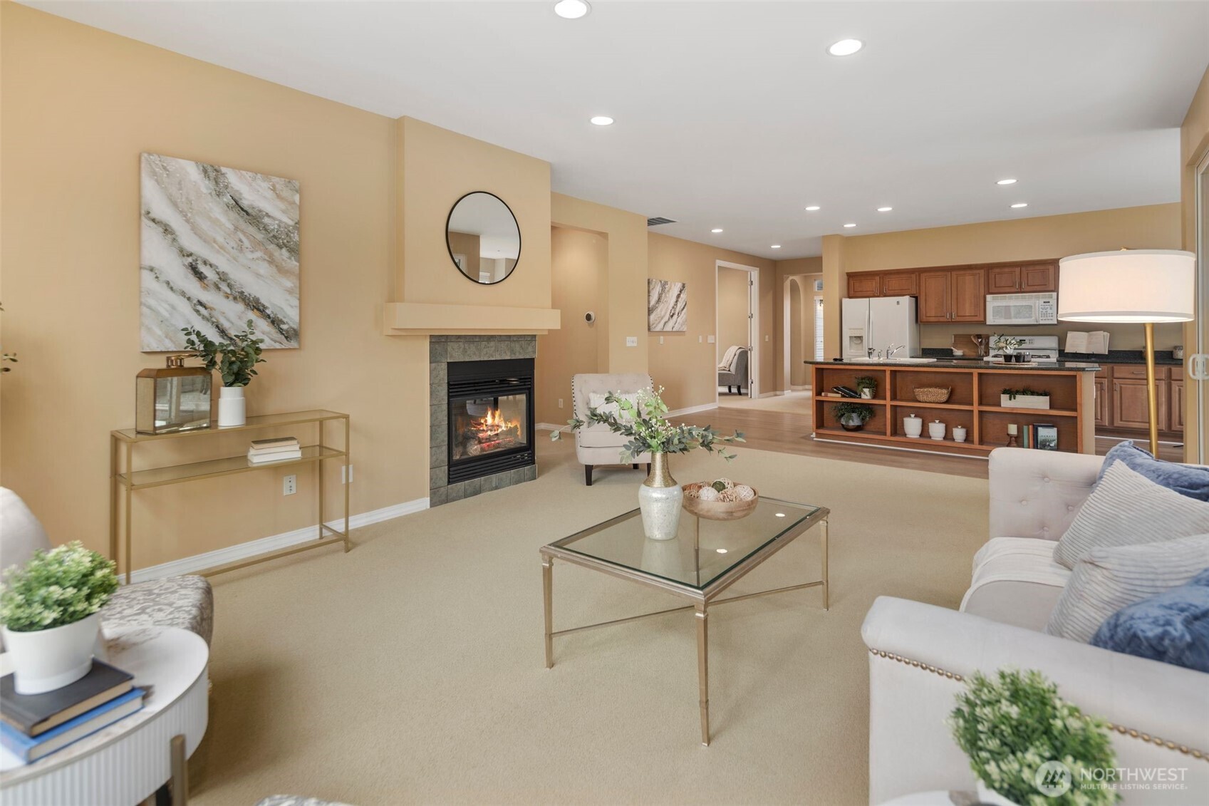 23124 Northeast Devon Way Redmond, WA 98053 - Photo 9 of 34 a living room with furniture kitchen view and a fireplace