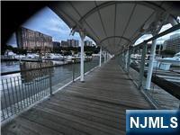 52 Anderson Avenue, Unit 2 Fairview, NJ 07022 - Photo 2 of 3 a view of a swimming pool with outdoor seating