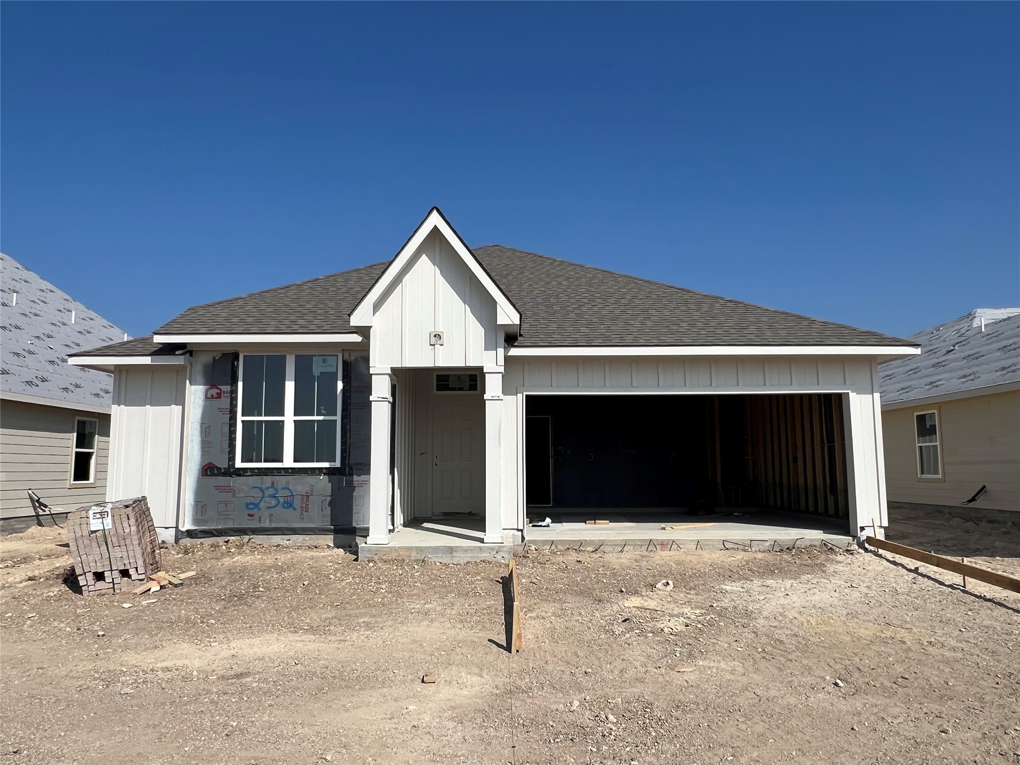 232 Gus Loop Georgetown, TX 78626 - Photo 1 of 22 a front view of a house with a garage