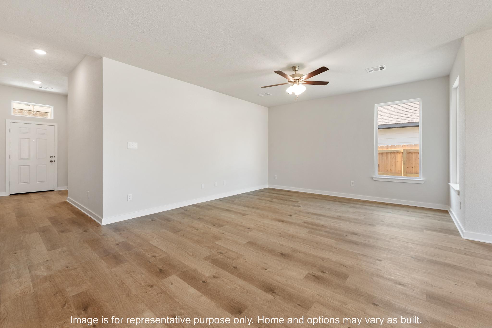 232 Gus Loop Georgetown, TX 78626 - Photo 13 of 22 wooden floor in an empty room with a window