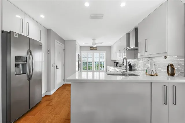 a view of a room with wooden floor and bathroom view