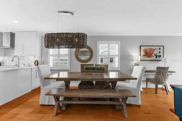 a view of a dining room with furniture and a window