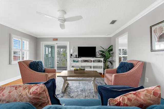a kitchen with granite countertop white cabinets and stainless steel appliances