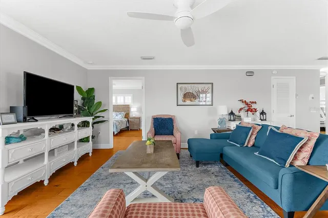 a kitchen with stainless steel appliances granite countertop a table chairs sink and cabinets