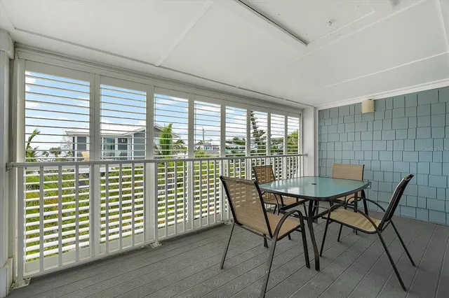 a view of a house with backyard fountain and sitting area