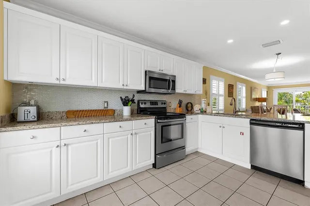 a tall wooden building with a yard