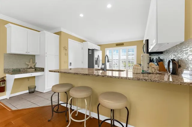 a view of a city from a dining room with furniture window and outside view