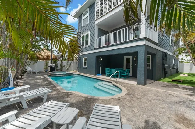 a living room with furniture and a clock