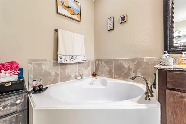 a bathroom with a shower and a sink