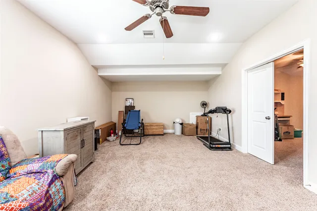 a front view of a house with a yard and tree s