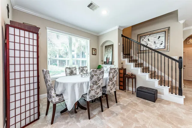 a view of a dining room with furniture window and outside view