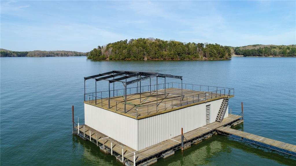 a view of a roof deck with lake view and mountain view
