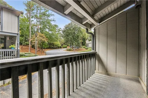 a view of balcony with wooden floor and outdoor space