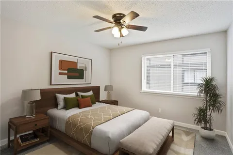 a bedroom with a bed and window