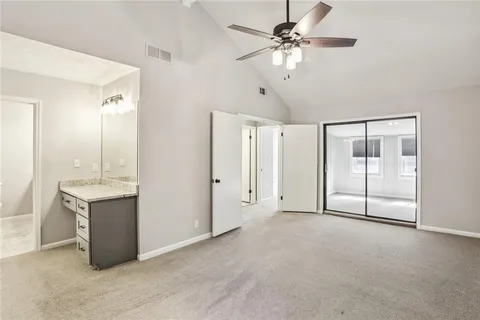 a view of an empty room with a bathroom