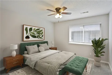 a bedroom with a bed and furniture