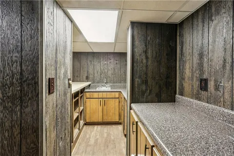 a view of wooden floor and a window