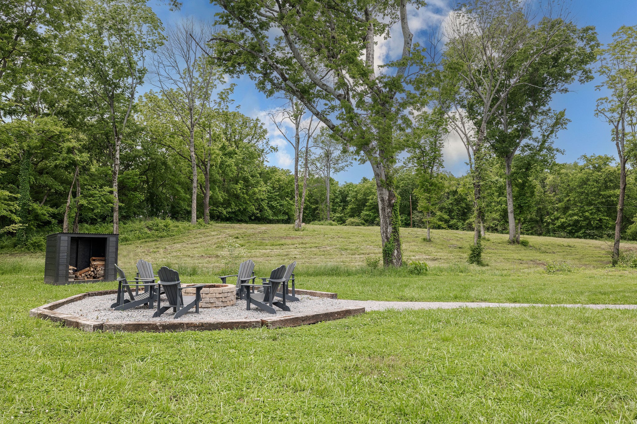 3309 Blazer Road Franklin, TN 37064 - Photo 9 of 32 a view of a backyard with table and chairs