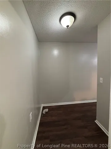 an empty room with a empty space and a window