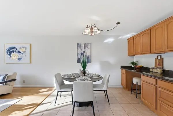 a dining room with furniture and window