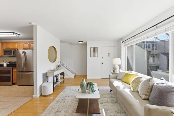 a living room with furniture and a large window